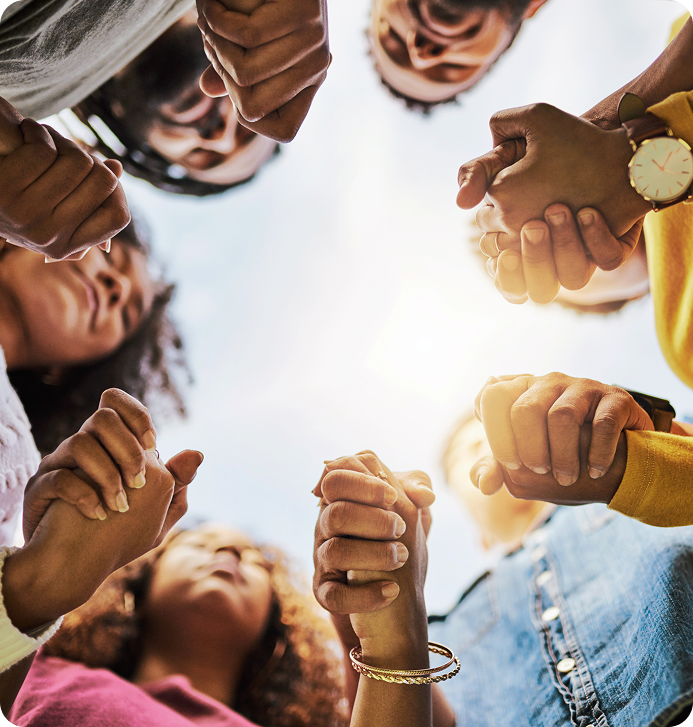 Group of hands joined together in a circle