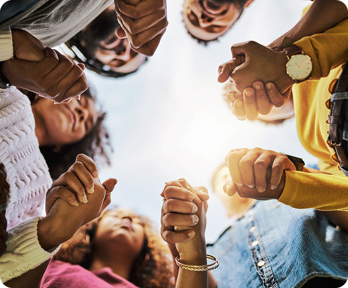 Circle of hands joined in community